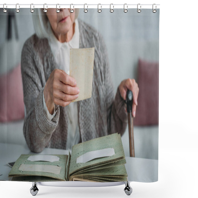 Personality  Partial View Of Senior Woman Looking At Photo From Photo Album At Table At Home Shower Curtains