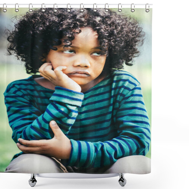 Personality  Unhappy Bored Little African American Kid Sitting In The Park. The Boy Showing Negative Emotion. Child Trouble Concept. Shower Curtains