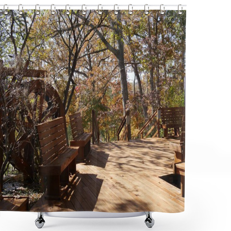 Personality  Wide Shot Of A Wooden Walkway With Benches And Working Waterwheel At A Park Shower Curtains