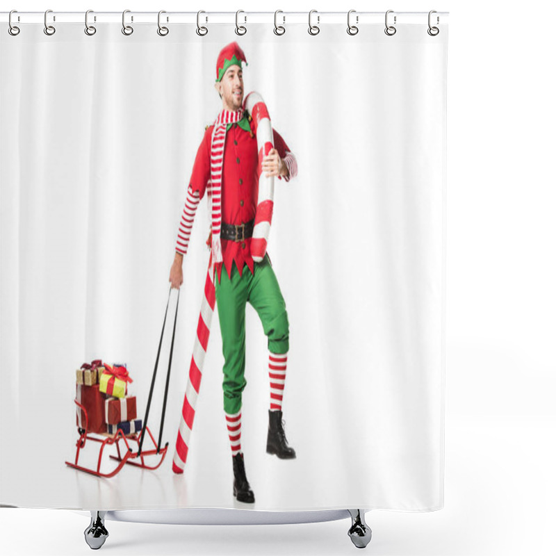 Personality  Smiling Man In Christmas Elf Costume Carrying Sleigh With Presents And Big Candy Cane Isolated On White Shower Curtains