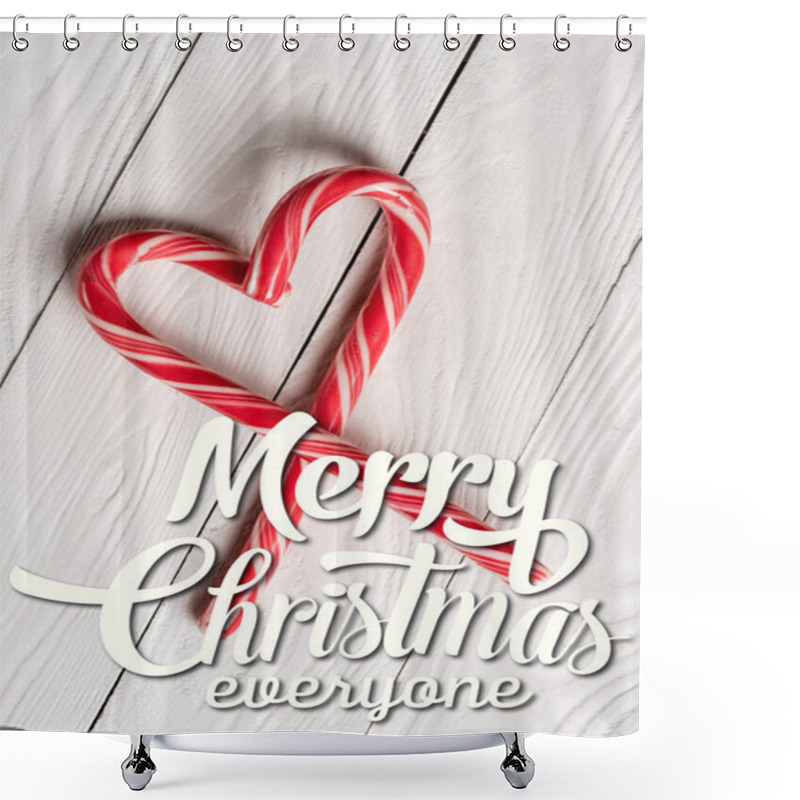 Personality  Top View Of Candy Canes In Shape Of Heart Near Merry Christmas Lettering On Wooden Background Shower Curtains