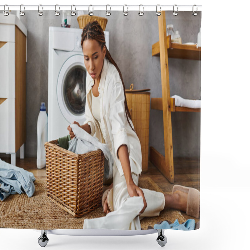 Personality  An African American Woman With Afro Braids Sits On The Floor Next To A Laundry Basket In A Bathroom, While Doing Housework. Shower Curtains