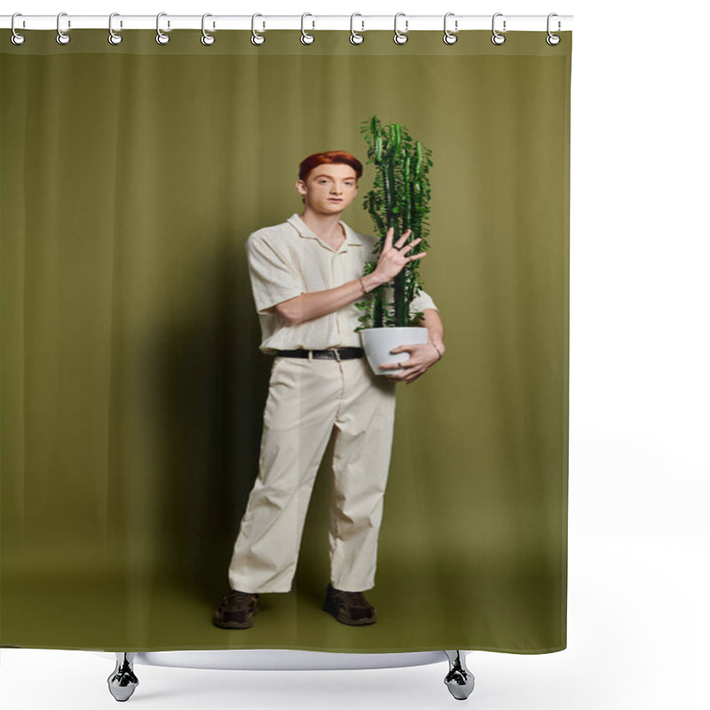 Personality  A Young Man Cradles A Tall Plant, Expressing Emotion Against A Serene Green Wall. Shower Curtains