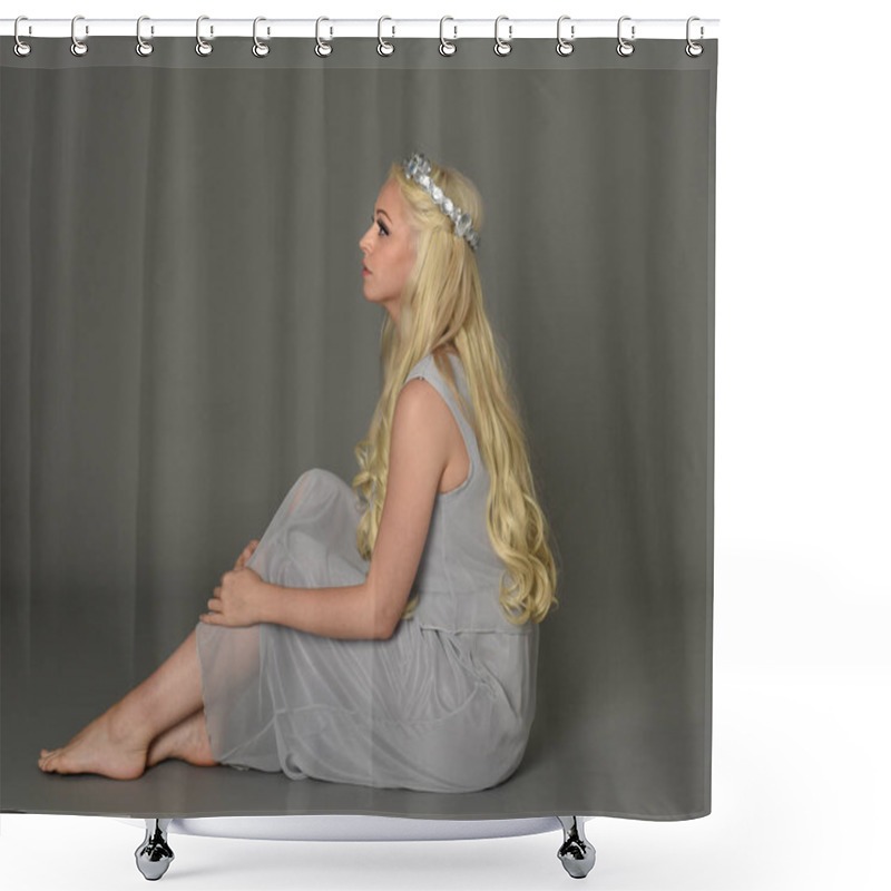 Personality  Full Length Portrait Of Blonde Woman Wearing Crown And Pale Blue Dress. Seated Pose Against A Grey Studio Background. Shower Curtains