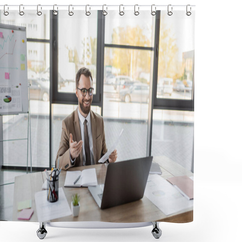 Personality  Charismatic And Happy Businessman In Eyeglasses, Beige Blazer And Tie Holding Documents And Pointing With Hand During Video Chat On Laptop Near Notebook, Papers And Stationery On Work Desk  Shower Curtains