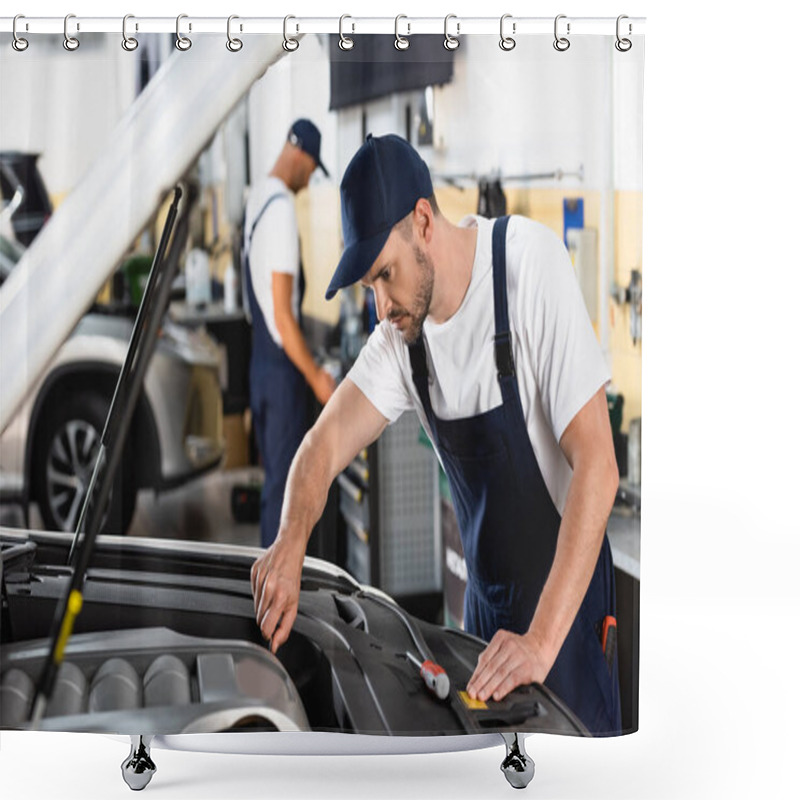 Personality  Selective Focus Of Mechanic In Cap Repairing Car Near Coworker In Workshop  Shower Curtains