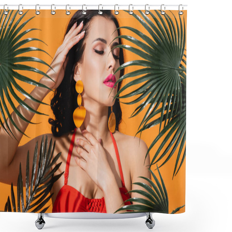 Personality  Young Woman With Closed Eyes Touching Face Near Green Palm Leaves Isolated On Orange  Shower Curtains