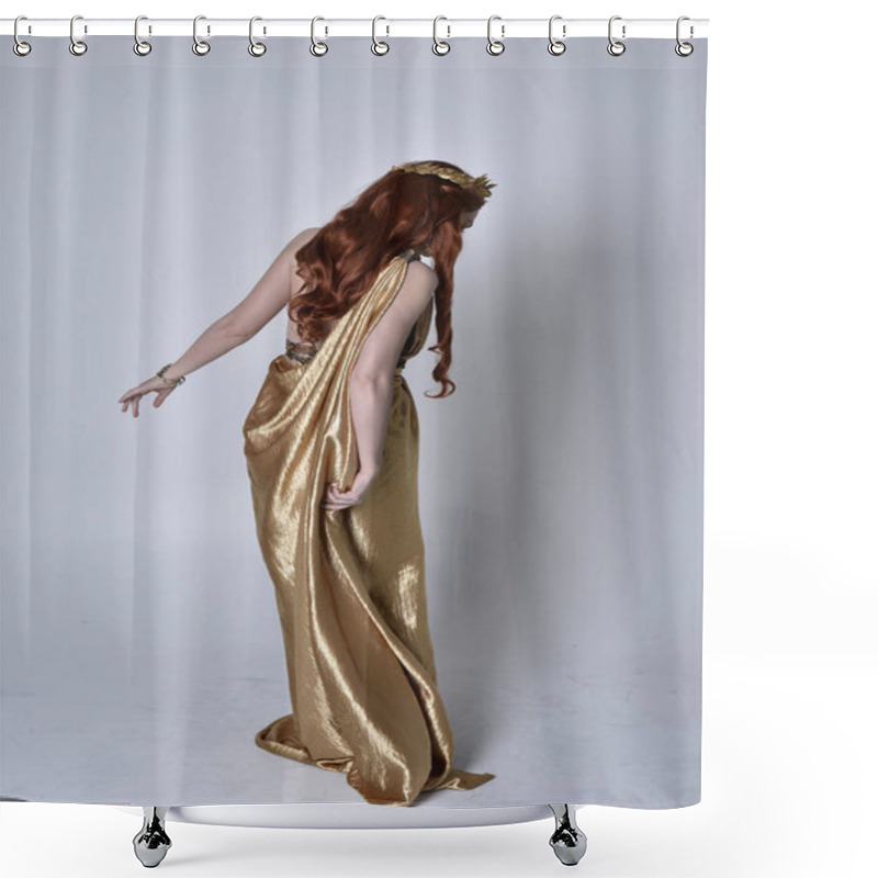 Personality  Full Length Portrait Of Girl With Red Hair Wearing Long Grecian Toga And Golden Wreath. Standing Pose With Back To The Camera,  Isolated Against A Grey Studio Background. Shower Curtains