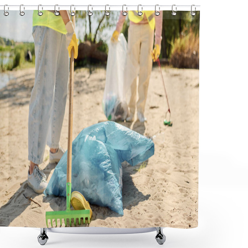 Personality  A Couple Standing On A Sandy Beach, Dressed In Safety Vests And Gloves, Enjoying The View Of The Surrounding Landscape. Shower Curtains