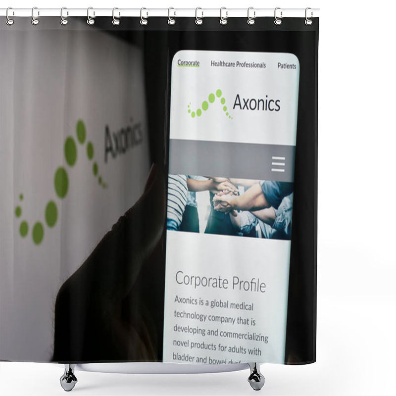 Personality  Stuttgart, Germany - 02-22-2024: Person Holding Smartphone With Logo Of US Modulation Technology Company Axonics Inc. In Front Of Website. Focus On Phone Display. Shower Curtains