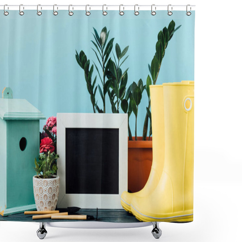 Personality  Close Up View Of Plants In Flowerpots, Rubber Boots, Birdhouse, Gardening Equipment And Empty Blackboard On Wooden Tabletop On Blue Shower Curtains