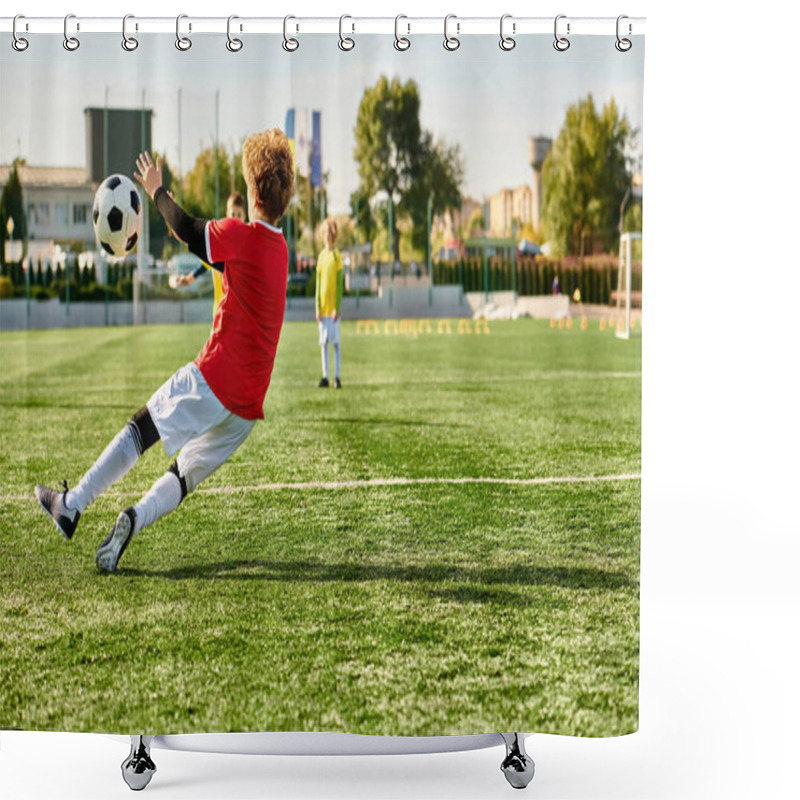 Personality  A Young Boy Energetically Kicks A Soccer Ball, Sending It Soaring Across A Vast Field. His Focused Expression And Precise Technique Demonstrate His Passion For The Sport. Shower Curtains