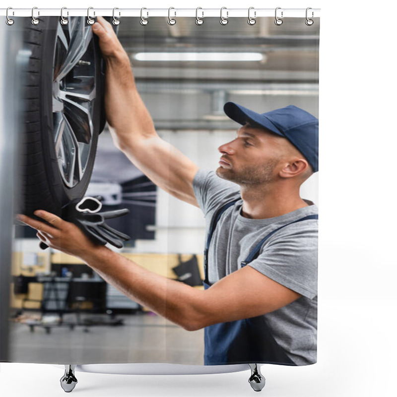 Personality  Side View Of Handsome Technician In Overalls And Cap Looking At Car Tire And Holding Gloves Shower Curtains