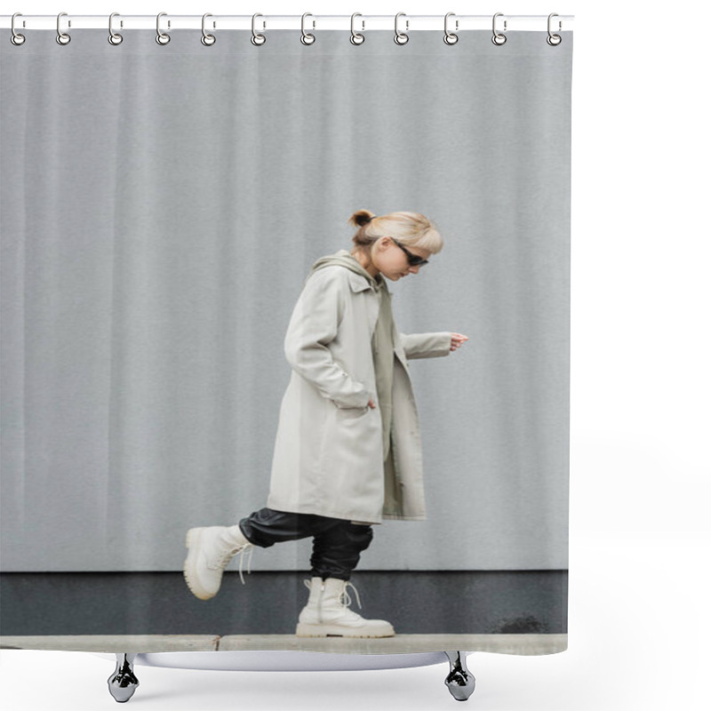 Personality  Full Length Of Young Woman In Stylish Sunglasses, Long Hoodie, Coat, Black Leather Pants And Beige Boots Walking With Hand In Pocket Near Grey Wall Of Modern Building And Looking Down  Shower Curtains