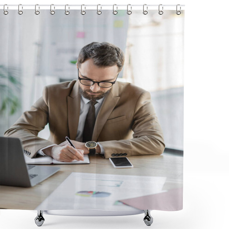 Personality  Successful Entrepreneur In Trendy Blazer, Eyeglasses And Luxury Wristwatch Writing In Notebook Next To Laptop, Smartphone With Blank Screen And Documents With Charts On Desk In Office Shower Curtains