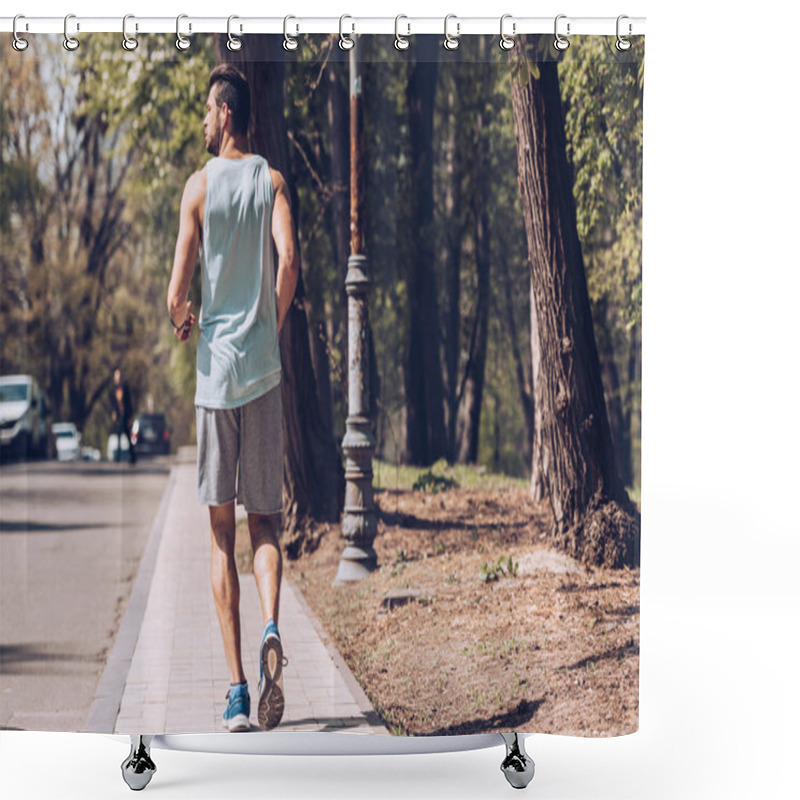 Personality  Back View Of Young Sportsman Running Along Pavement Near Roadway Shower Curtains