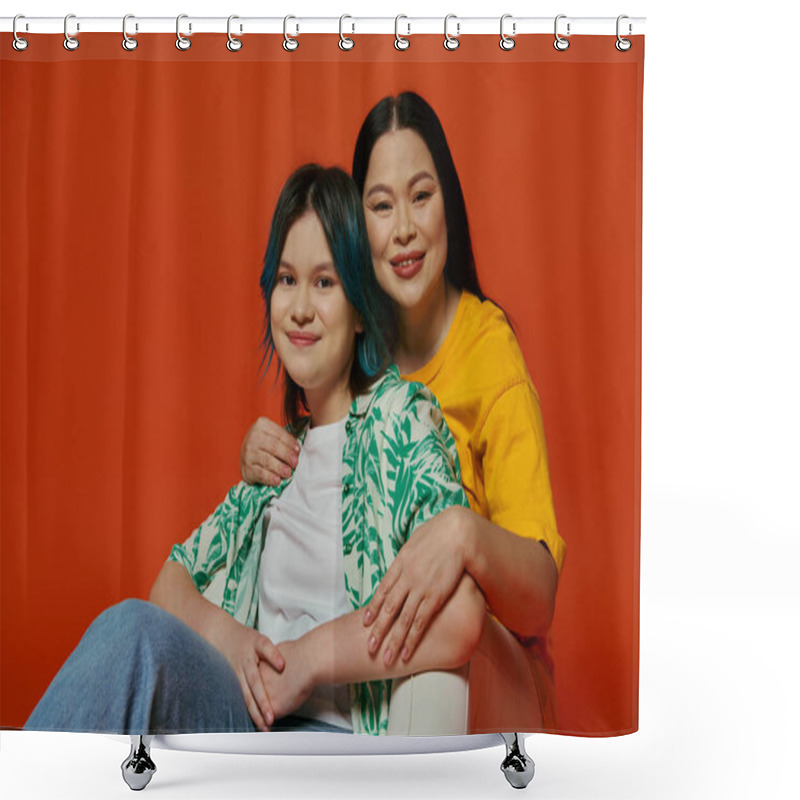 Personality  An Asian Mother And Her Teenage Daughter Sit Gracefully On A Chair Against A Vibrant Red Background. Shower Curtains