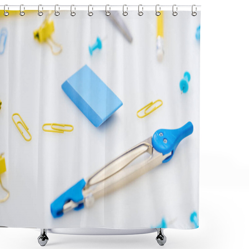 Personality  Selective Focus Of Blue Compasses, Eraser And Paper Clips Mixed With Yellow Paper Clips And Pencil On White Background Shower Curtains