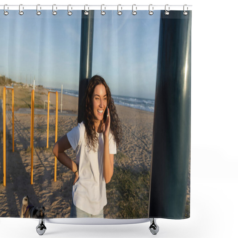 Personality  Cheerful Young Woman Talking On Smartphone While Standing With Hand On Hip On Beach In Barcelona  Shower Curtains