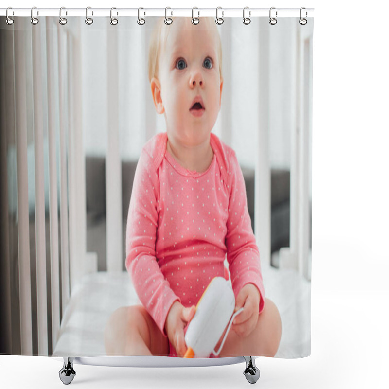 Personality  Selective Focus Of Excited Infant Holding Baby Monitor In Crib  Shower Curtains