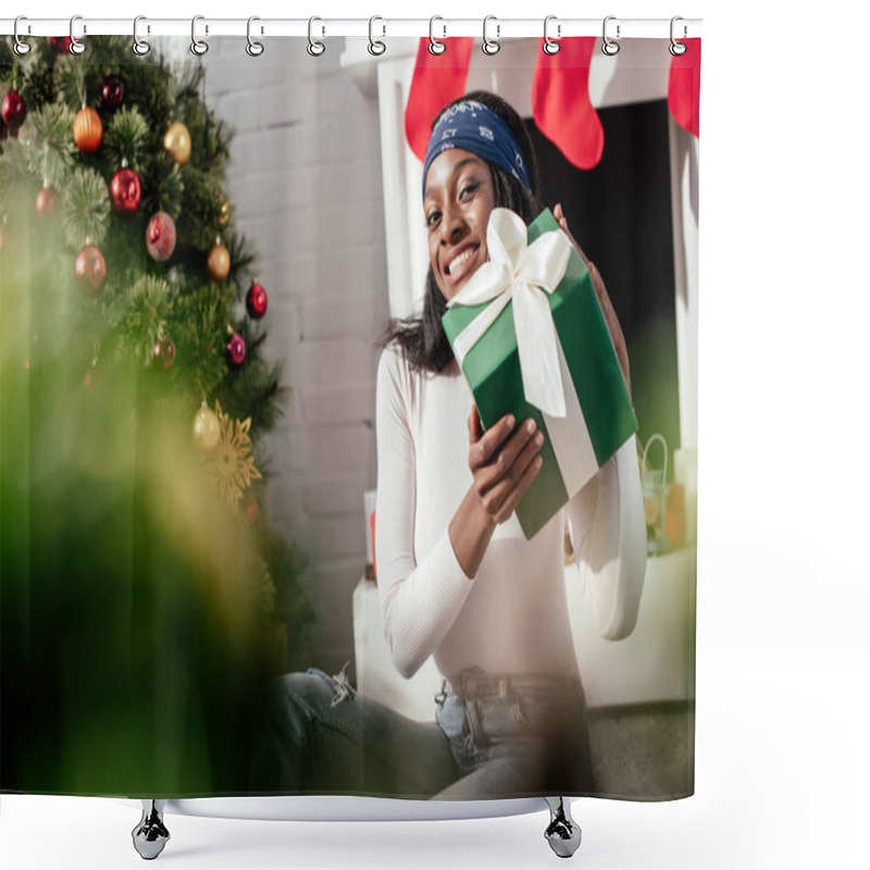 Personality  Excited Attractive African American Woman Holding Christmas Present At Home And Looking At Camera Shower Curtains