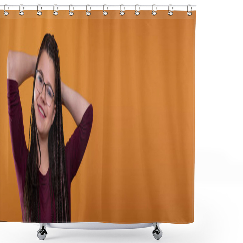 Personality  In A Panoramic Shot, A Young Girl With Glasses With Her Hands On Her Head, Sincerely Smiles. Orange Thinned Background. Character Isolated From The Background. Shower Curtains