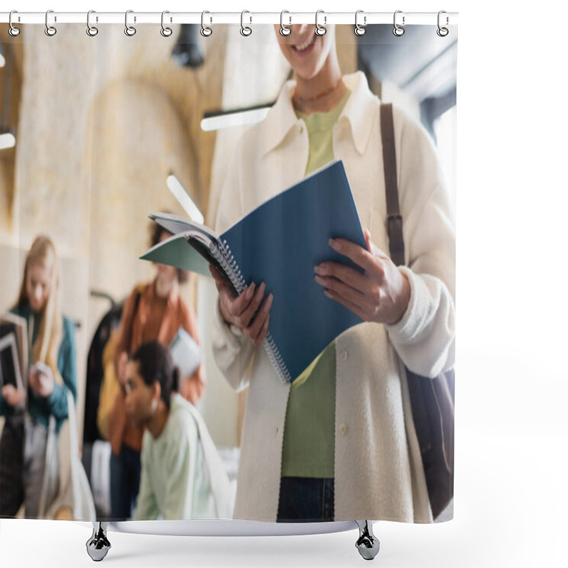 Personality  Smiling Woman Standing With Copybooks Near Interracial Classmates On Blurred Background Shower Curtains