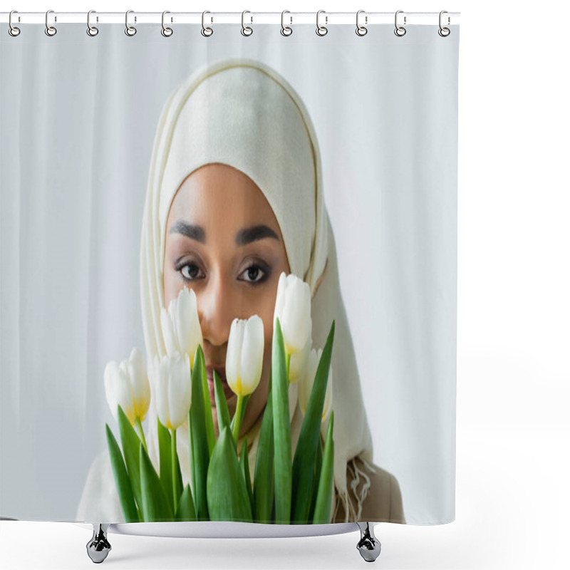 Personality  Muslim Woman In Hijab Looking At Camera Through Tulips Isolated On Grey Shower Curtains