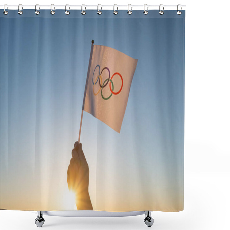 Personality  The Olympic Flag, Small In Hand, Flutters Against The Backdrop Of Blue Sky And Setting Sun. Concept For Winter And Summer Olympic Games, 2021, 2022. Shower Curtains