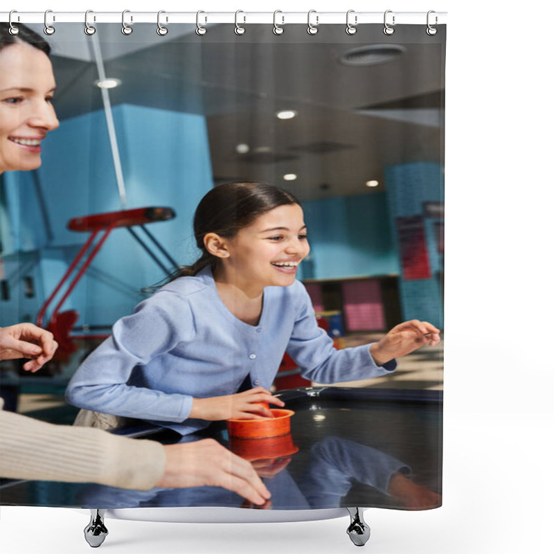 Personality  A Woman And A Girl Share Laughs And Excitement As They Face Off In An Intense Game Of Air Hockey At The Malls Gaming Zone. Shower Curtains