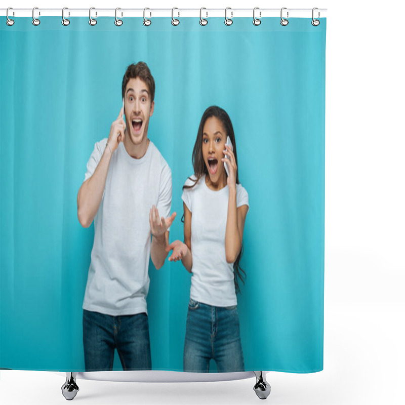 Personality  Excited Interracial Couple Talking On Smartphones While Standing With Open Arms On Blue Background Shower Curtains