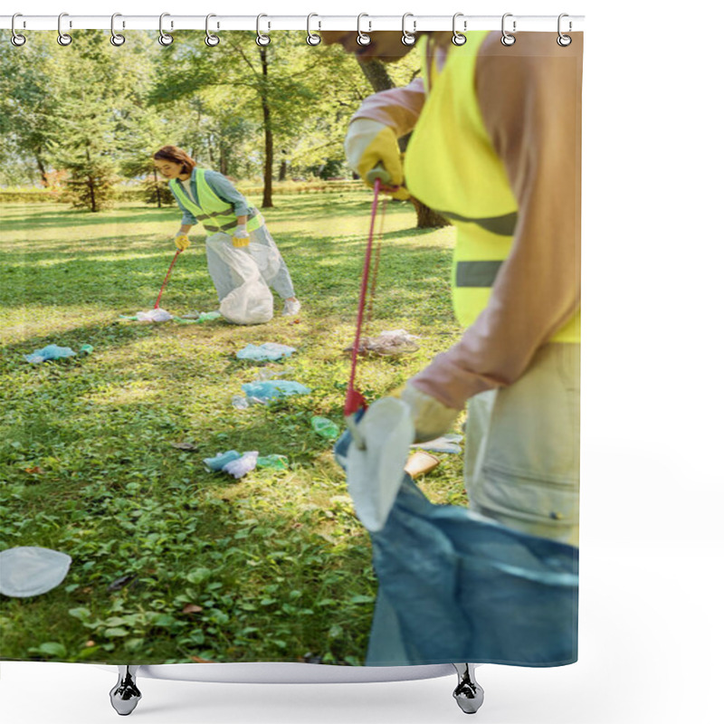 Personality  A Socially Active, Diverse Loving Couple In Safety Vests And Gloves Clean A Park As A Group Stands On A Lush Green Field. Shower Curtains