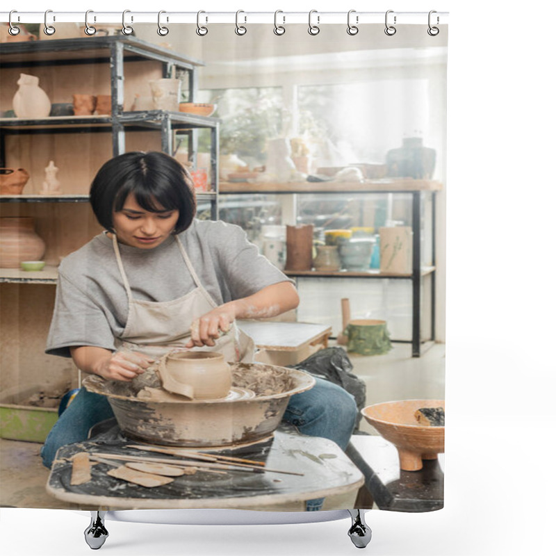 Personality  Brunette Asian Female Artisan In Apron Cutting Wet Clay On Spinning Pottery Wheel While Working Near Wooden Tools And Bowl In Blurred Ceramic Workshop, Clay Shaping And Forming Process Shower Curtains