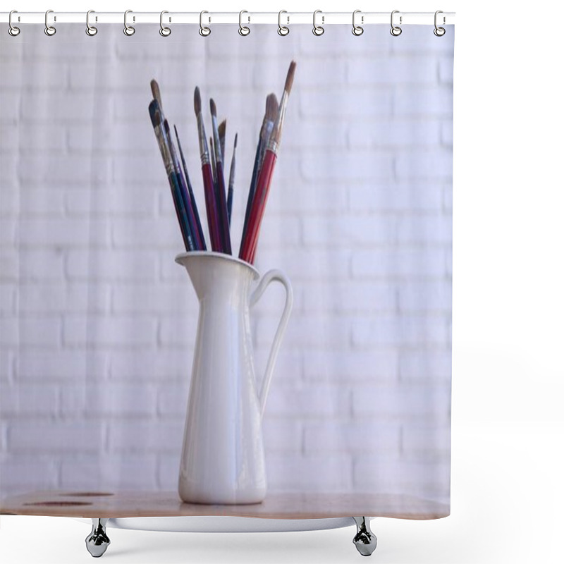 Personality  Collection Of Used Paintbrushes In A Ceramic Jug Against A White Brick Wall. High Quality Photo Shower Curtains