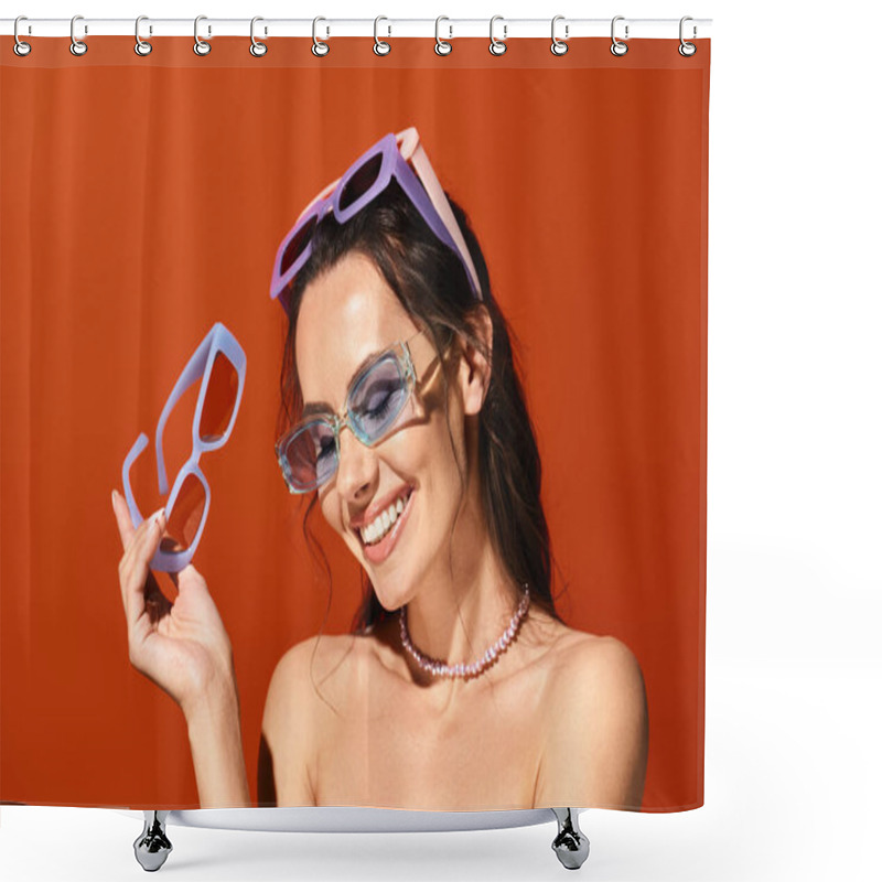 Personality  A Stylish Woman In Sunglasses Holding Up A Pair Of Glasses In A Studio Against An Orange Background, Showcasing Summertime Fashion. Shower Curtains