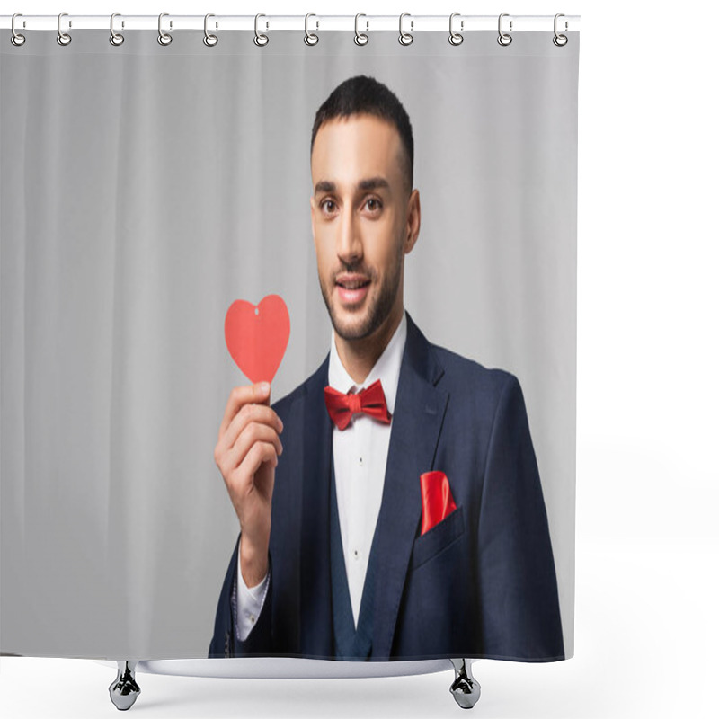 Personality  Elegant Hispanic Man Smiling At Camera While Holding Red Paper Cut Heart Isolated On Grey Shower Curtains