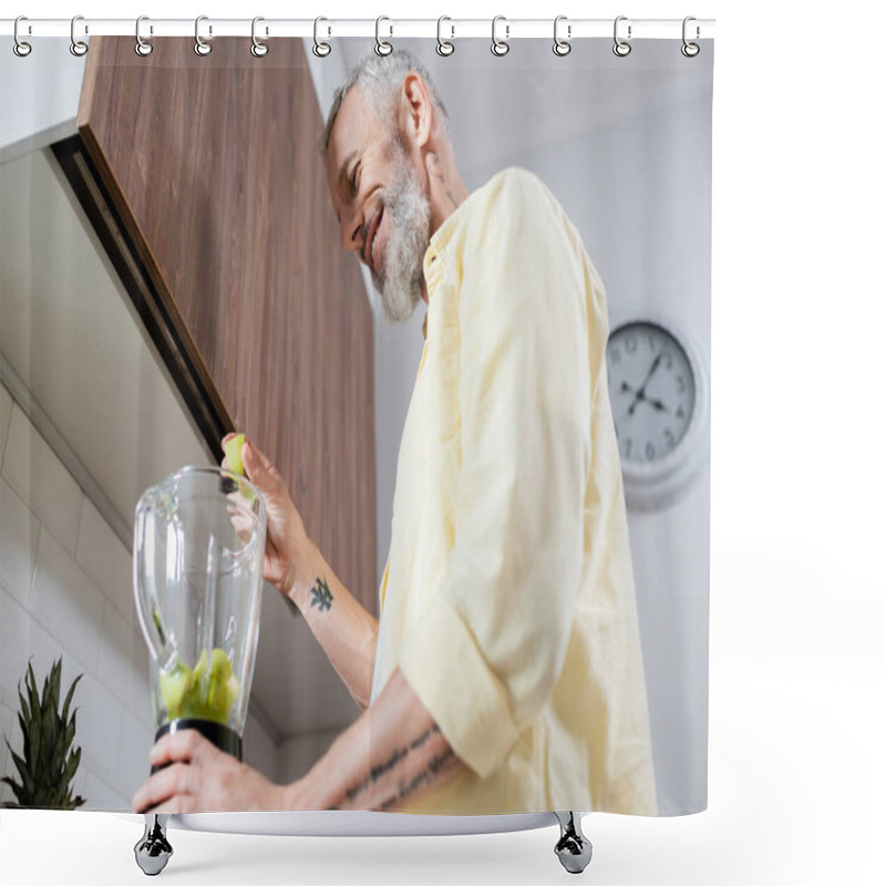 Personality  Low Angle View Of Positive Tattooed Man Pouring Fruits In Blender In Kitchen  Shower Curtains