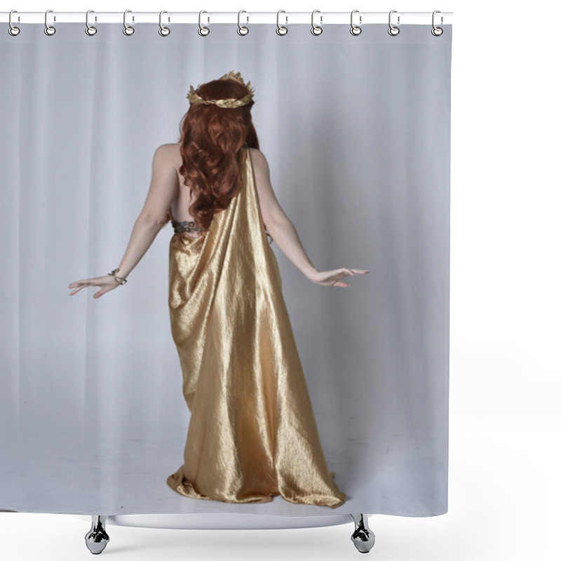 Personality  Full Length Portrait Of Girl With Red Hair Wearing Long Grecian Toga And Golden Wreath. Standing Pose With Back To The Camera,  Isolated Against A Grey Studio Background. Shower Curtains