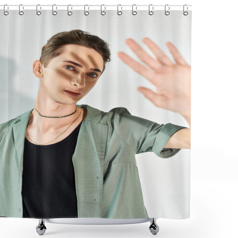 Personality  A Young Queer Man In A Green Shirt Strikes A Hand Gesture, Showcasing Pride And Individuality In A Studio Setting On A Grey Background. Shower Curtains