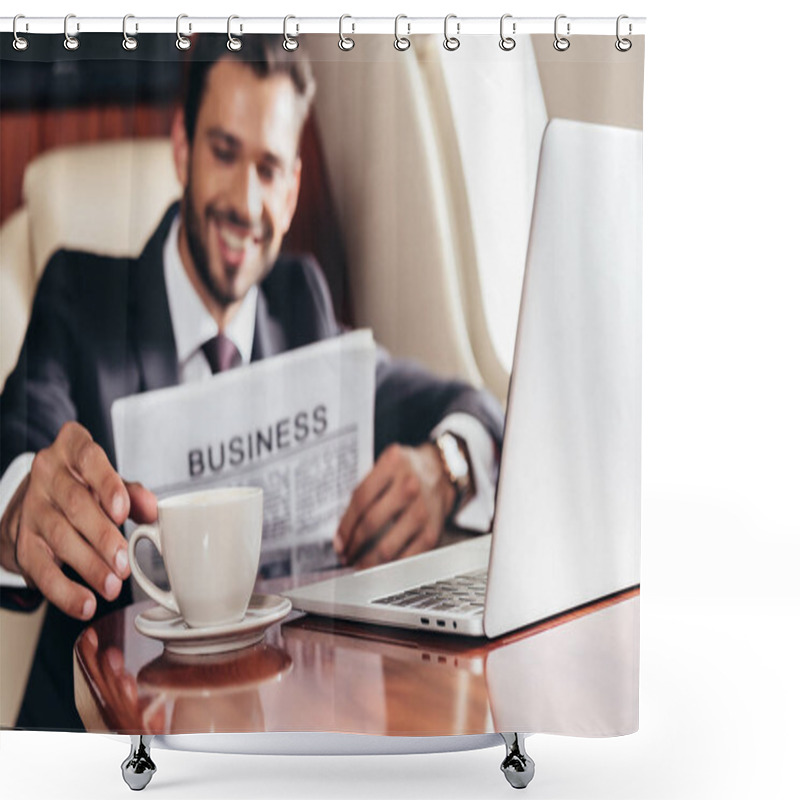 Personality  Selective Focus Of Smiling Businessman In Suit With Newspaper Taking Cup In Private Plane  Shower Curtains