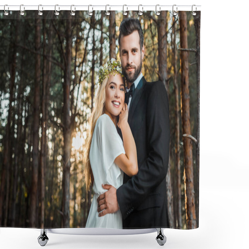 Personality  Low Angle View Of Smiling Wedding Couple Hugging And Looking At Camera During Sunset In Forest Shower Curtains