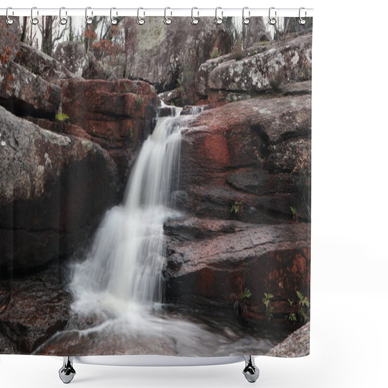 Personality  A Serene Waterfall Cascades Over Weathered Red Rocks, Surrounded By Lush Greenery, Creating A Tranquil And Inviting Scene.    Shower Curtains