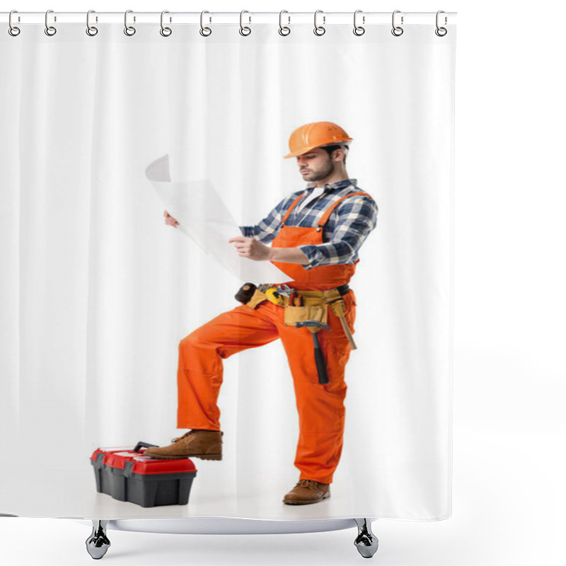 Personality  Builder In Orange Overall And Helmet Looking At Blueprint While Leaning On Tool Box Isolated On White Shower Curtains