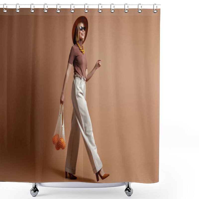 Personality  Fashionable Young Woman Carrying Mesh Bag With Oranges While Walking Against Brown Background Shower Curtains