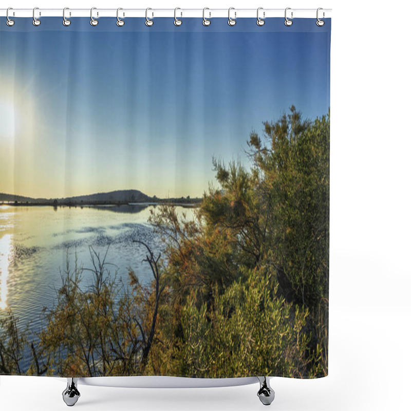 Personality  Sunlight Reflects On The Calm Waters Of Gialova Lagoon In Greece, Surrounded By Bushes And Distant Hills, Creating A Serene Atmosphere. Shower Curtains