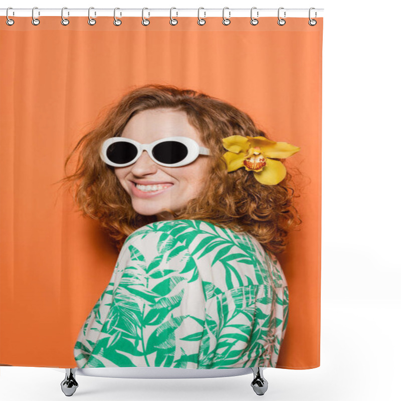 Personality  Positive Young Woman With Red Hair And Orchid Flower Posing In Sunglasses And Blouse With Floral Print On Orange Background, Summer Casual And Fashion Concept, Youth Culture Shower Curtains