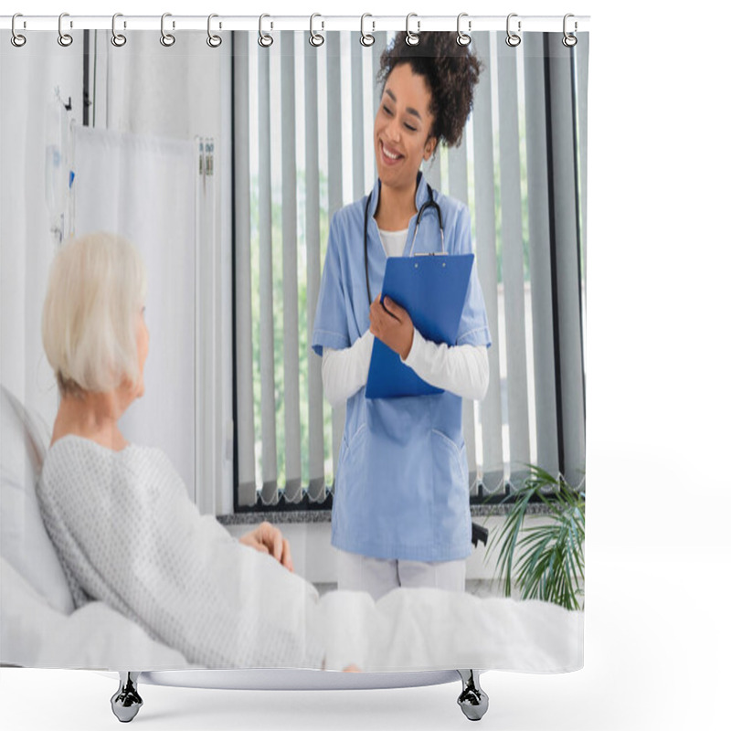 Personality  Cheerful African American Nurse With Clipboard Looking At Senior Patient On Bed  Shower Curtains