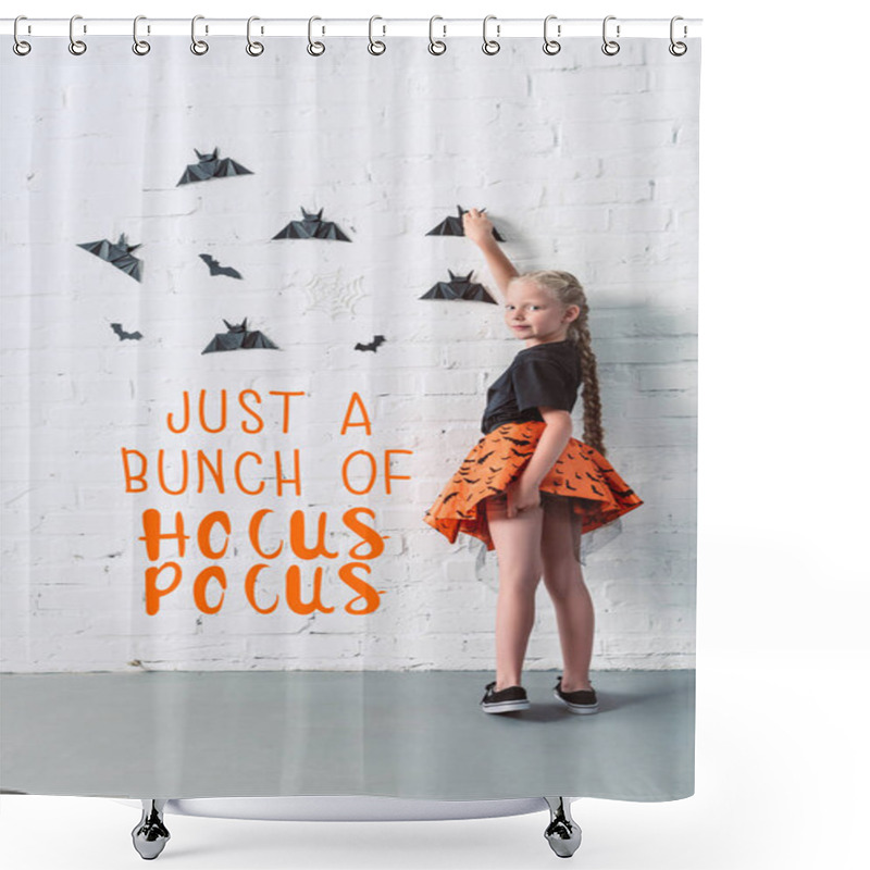 Personality  Back View Of Child In Skirt Hanging Black Paper Bats On White Brick Wall, Halloween Holiday Concept With 