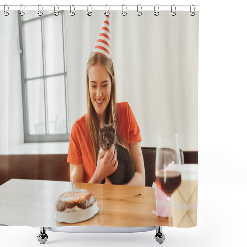 Personality  Selective Focus Of Happy Girl In Party Cap Looking At Birthday Cake And Holding In Arms Cat  Shower Curtains