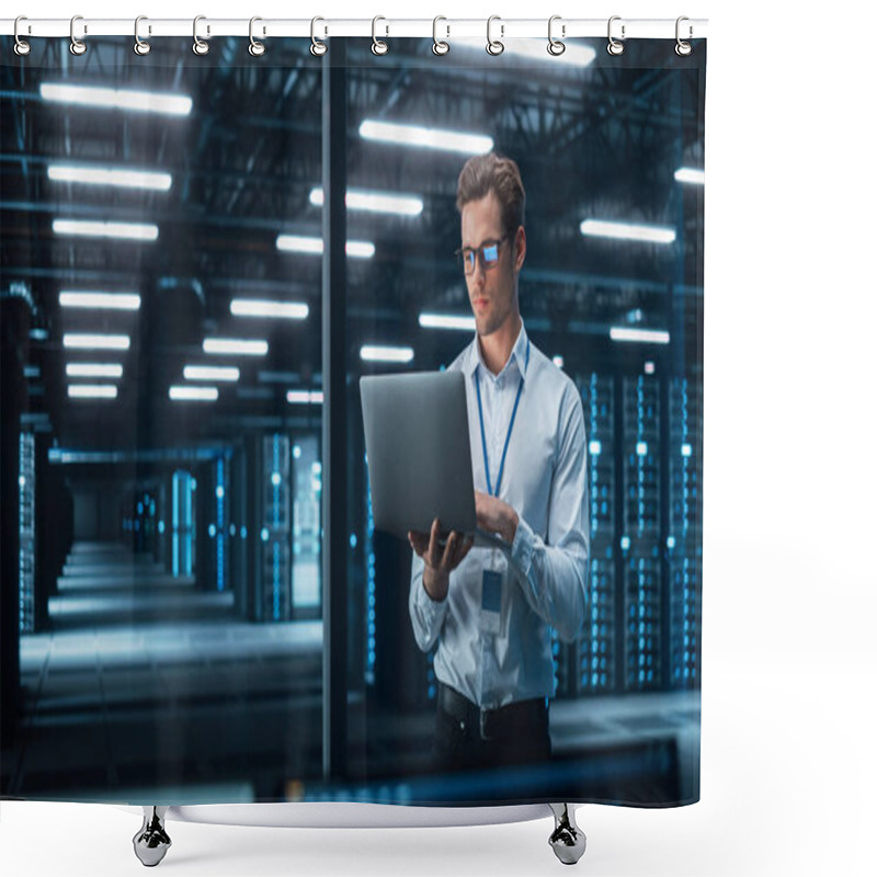 Personality  In Technology Research Facility: Chief Engineer Stands In The Middle Of The Lab And Uses Laptop Computer. E-Business Digital Entrepreneur Examining Cloud Web Services At The Evening Shower Curtains